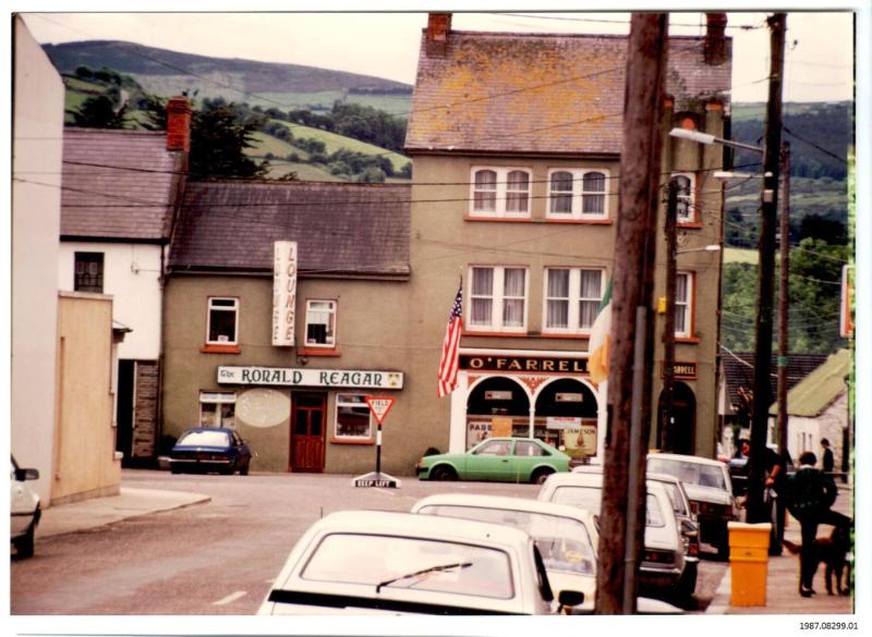 A color photograph of the Ronald Reagan Pub in Ballyporeen, Ireland in 1987. The pub was closed and the interior shipped to California in 2004. It is currently on display in the Air Force One Pavillion at the Ronald Reagan Presidential Library. Gifter: Mike Conner. Artifact ID: 1987.08299.01