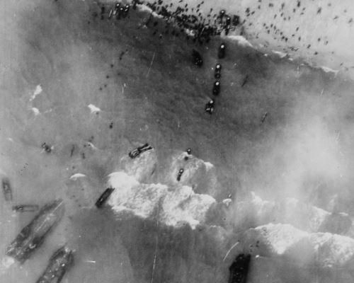 Photograph of Men and Assault Vehicles Storming the Beaches of Normandy