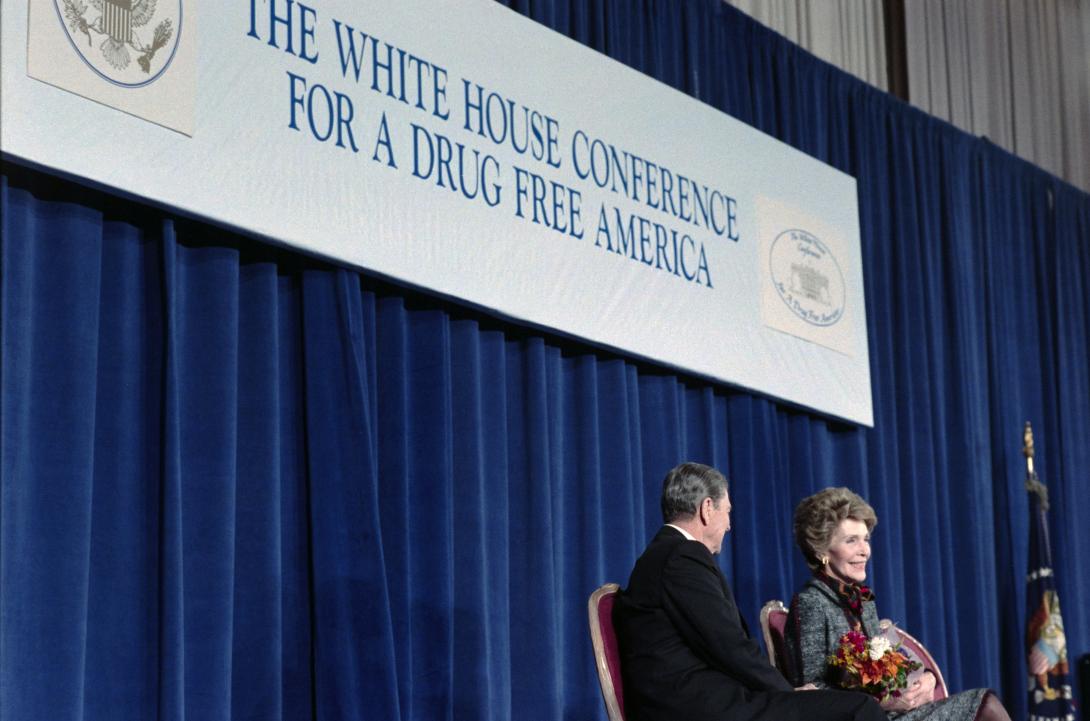 President Ronald Reagan and Nancy Reagan sitting at the podium during the White House Conference for a Drug Free America dated 02/29/1988