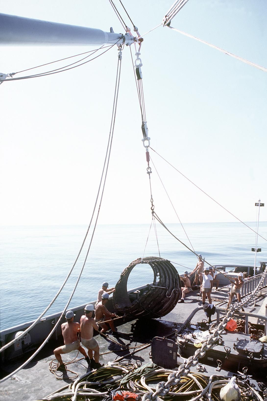 Crewmen use a crane to lift a piece of a rocket engine aboard the salvage ship USS PRESERVER (ARS-8) during the salvage operation for the Space Shuttle orbiter Challenger Record Group 330: Records of the Office of the Secretary of Defense 1921-2008 Series: Combined Military Service Digital Photographic Files 1982-2007 Produced: January 1, 1986. Local ID: 330-CFD-DN-STT-87-02418. NAID: 6421641.